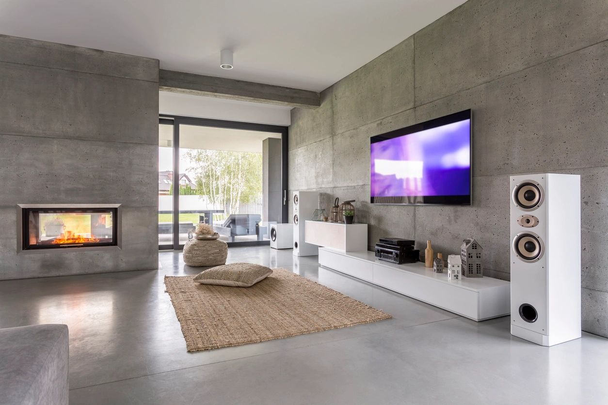 A living room with a large screen television.